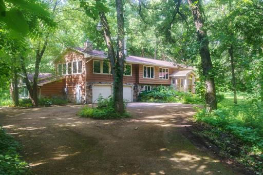 Welcome. Drive up the circular driveway with ample parking for guests.