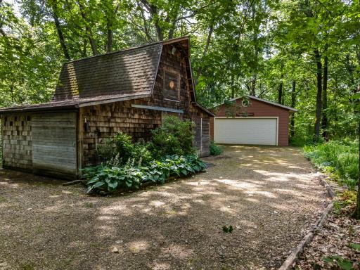 Features a quaint, rustic barn perfect for hobbies/storage, plus an oversized 24x29 detached garage for additional parking and workshop space.