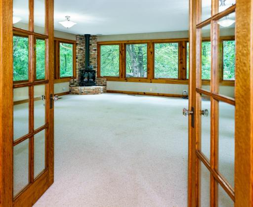 Dining Room to French Door entrance of the Great Room. All three sides have extensive window overage.