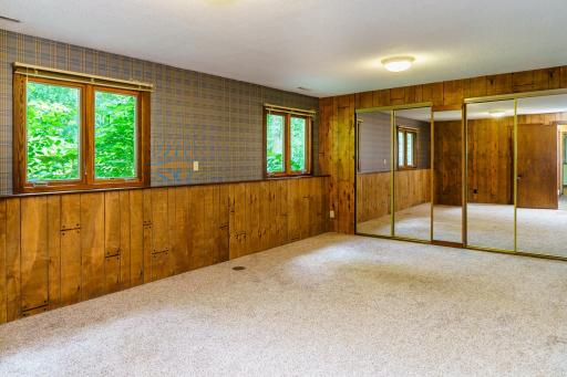 Lower Family/Exercise/Flex Room - Closets and storage behind the mirrored doors