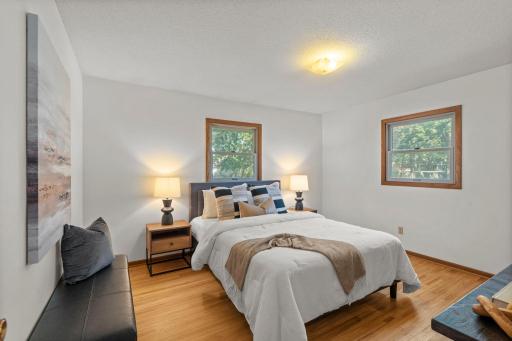 Three bedrooms all with hardwood floors and newer windows