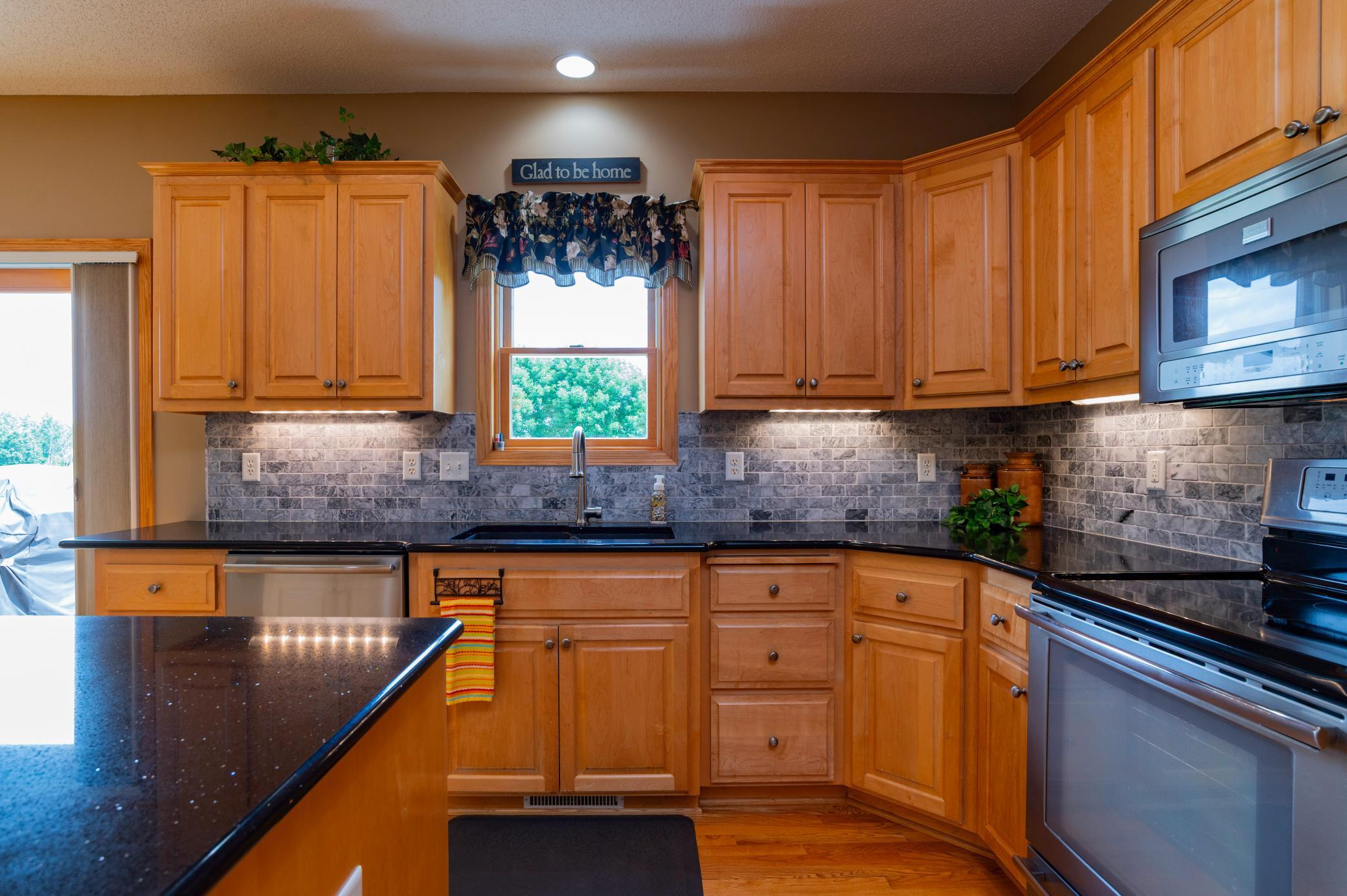 Beautiful maple cabinets with under cabinet lighting.jpg