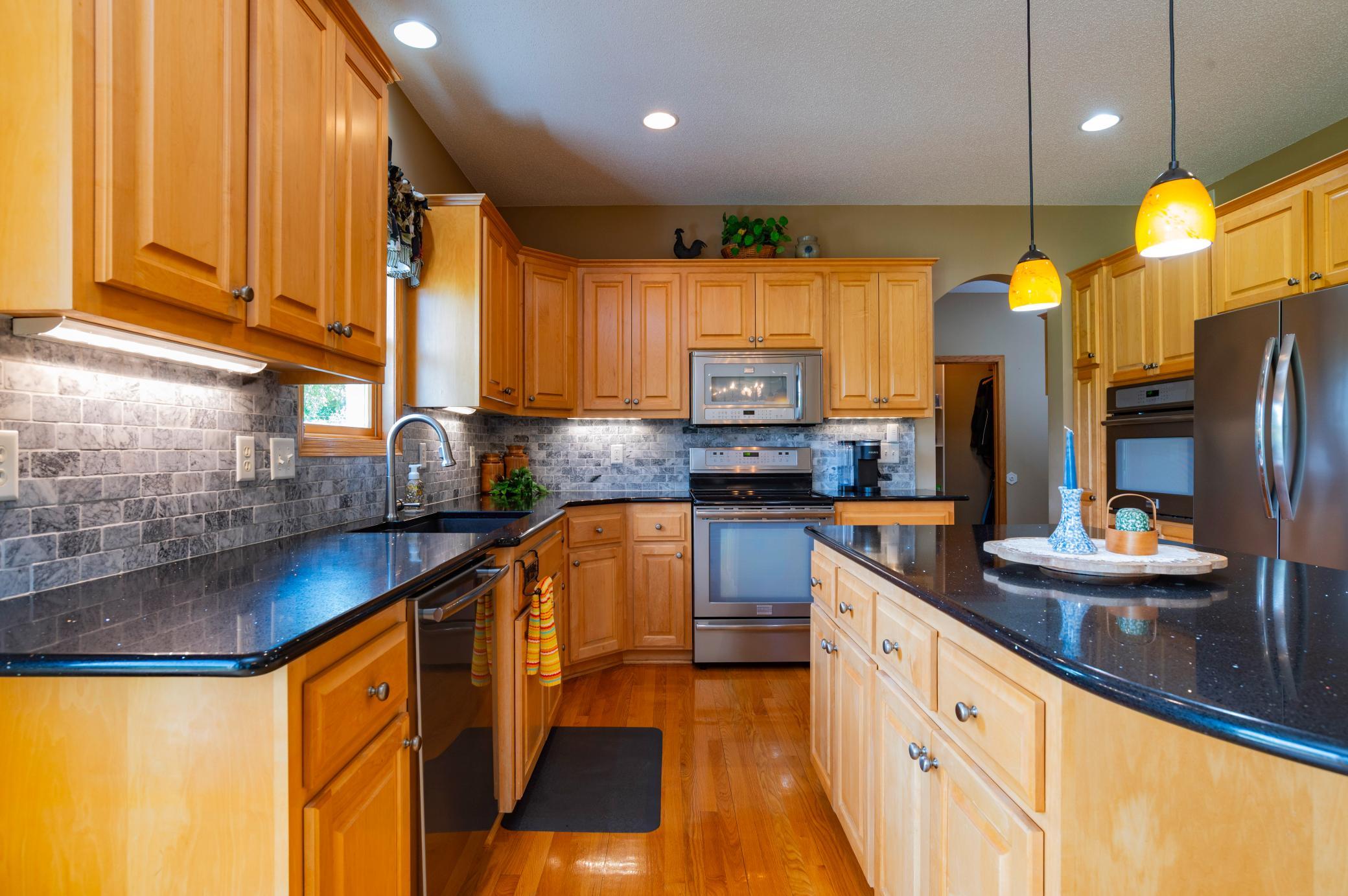Gleaming Cambria countertops and note the dual ovens for hosting the big gatherings.jpg
