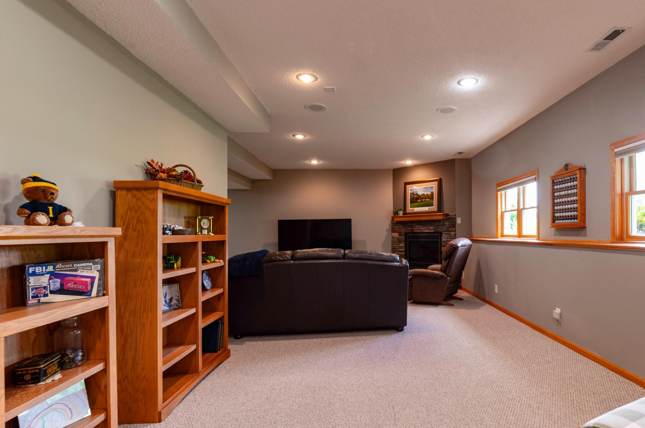 Lower level Amusement room space opens to the Family Room space.jpg