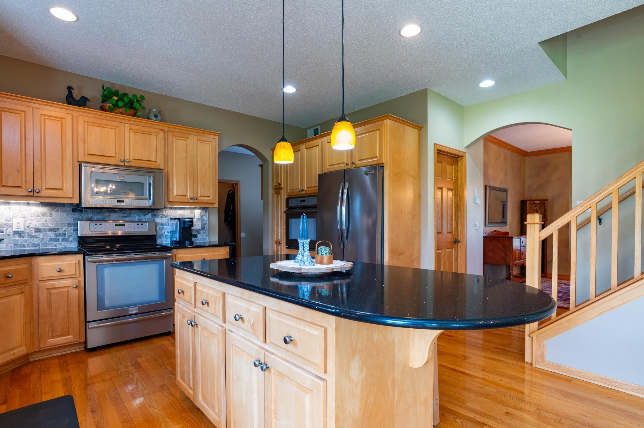 Kitchen is the hub of the home - right off the mud room and formal dining.jpg