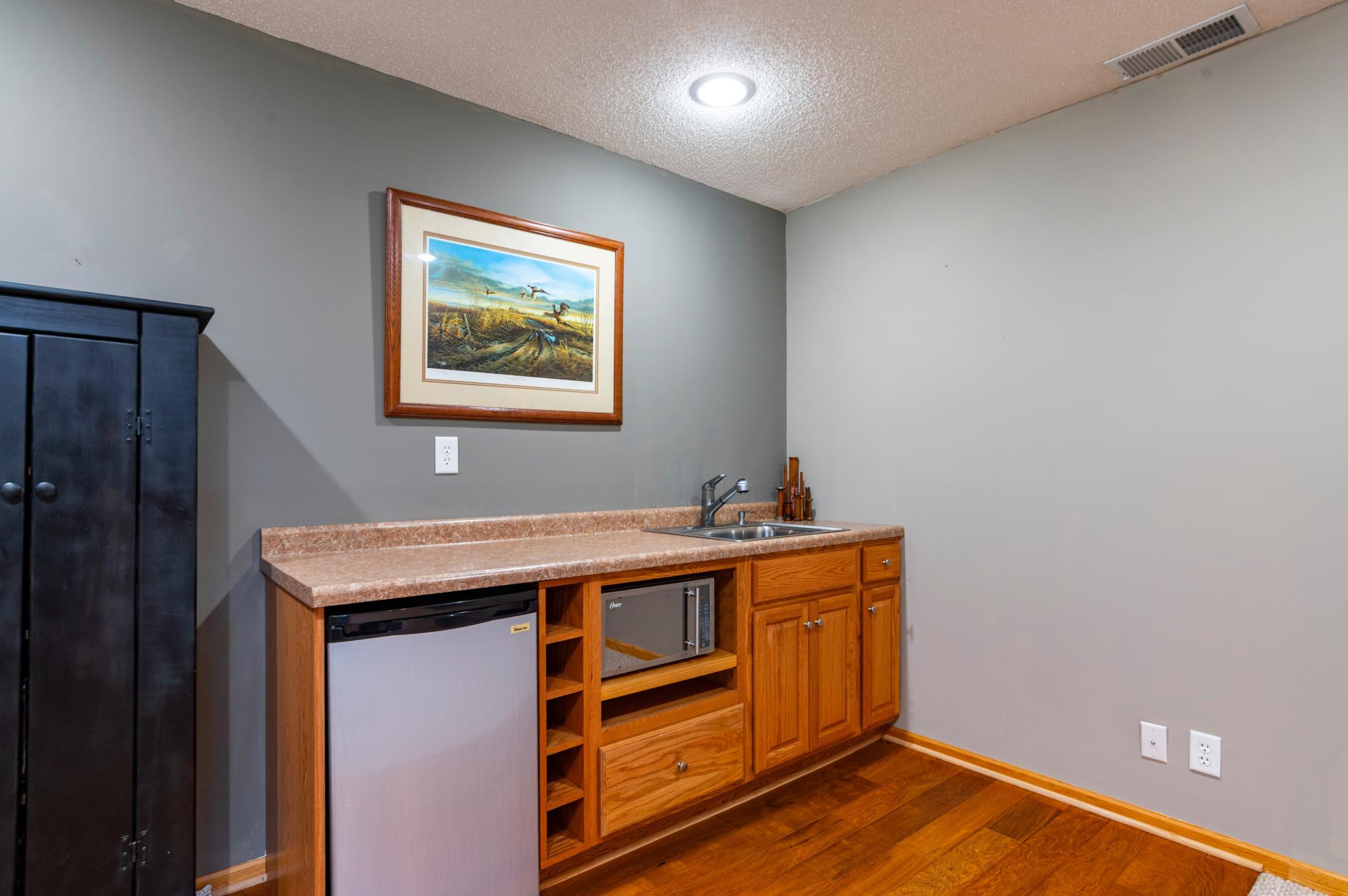 Lower level wet bar makes entertaining a breeze.jpg
