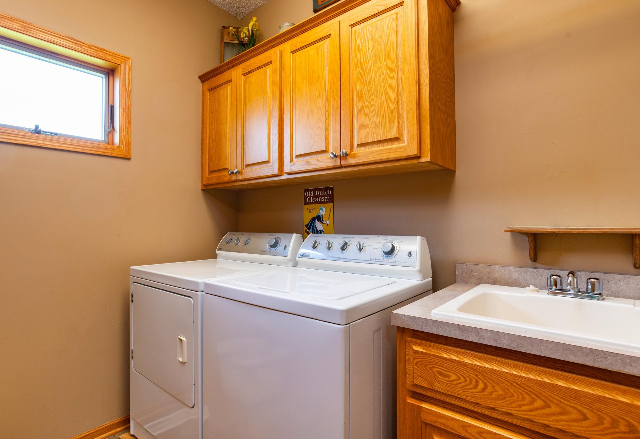 Main level laundry room right off mud room with handy utility sink.jpg