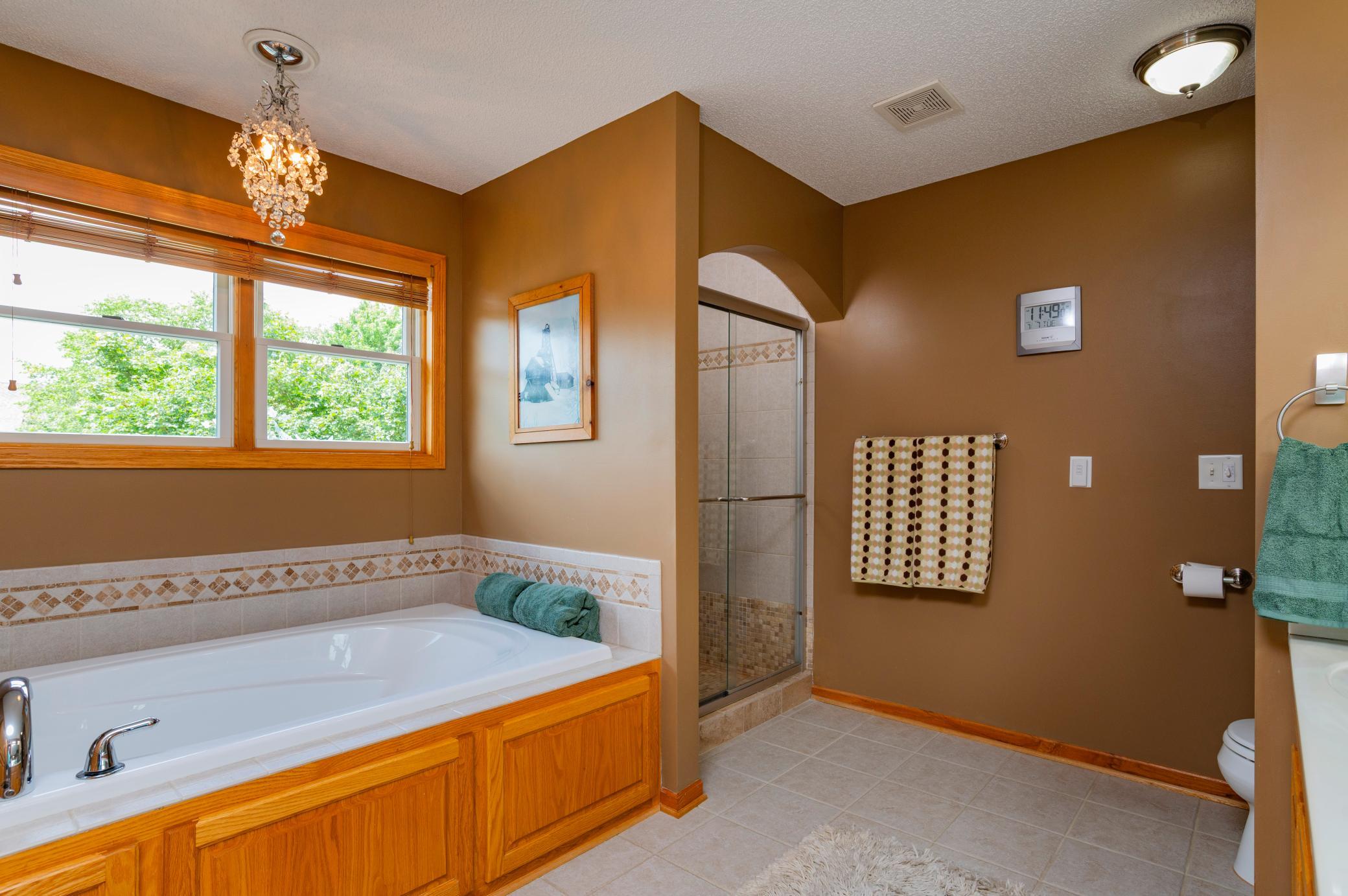 Relax in your jacuzzi tub after playing the course or step into the separate tiled shower.jpg
