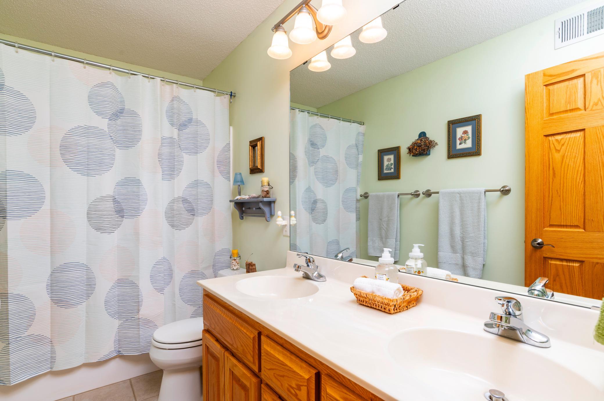 Upper level full bath with dual sinks.jpg