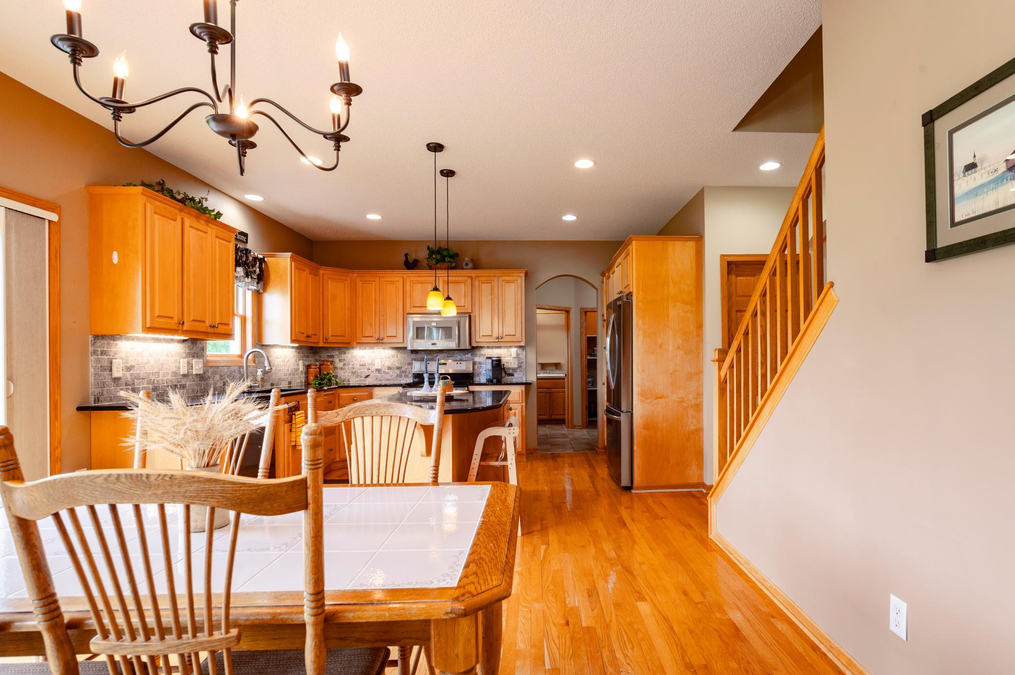 View from main level living room shows the open floorplan and gorgeous floors.jpg