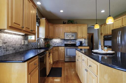 Gleaming Cambria countertops and note the dual ovens for hosting the big gatherings.jpg
