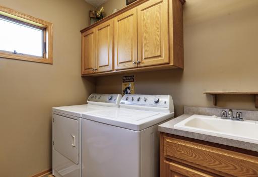 Main level laundry room right off mud room with handy utility sink.jpg