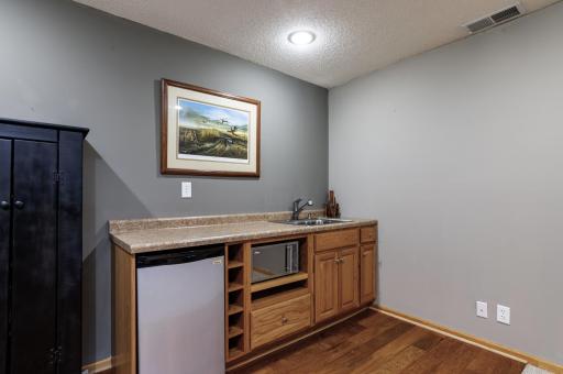 Lower level wet bar makes entertaining a breeze.jpg