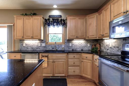 Beautiful maple cabinets with under cabinet lighting.jpg