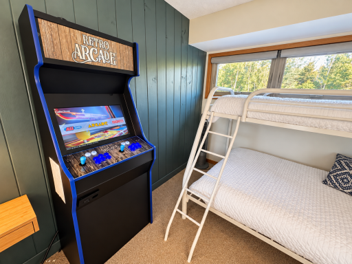 Arcade in the loft for rainy day entertainment.png