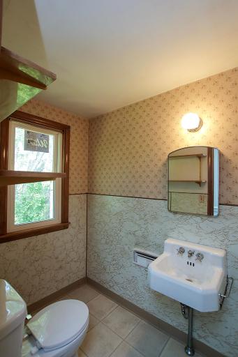 There is also a half bathroom conveniently located upstairs. Take note of the sticker still on the window - all windows in the house are updated vinyl.