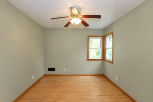 The main floor bedroom is good sized and has a fresh coat of paint. It also has a full wall of closet space.