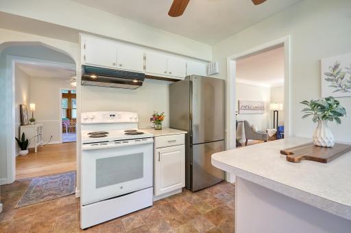Kitchen, notice the arched entryway to the back door