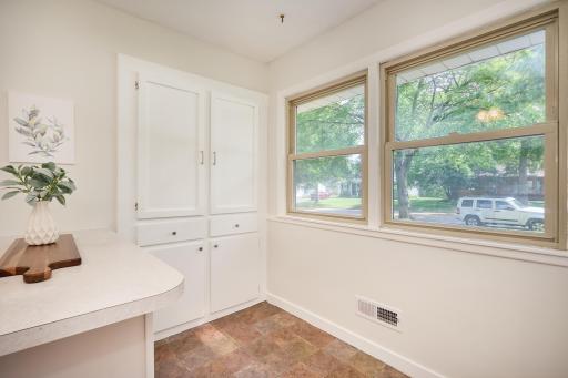 Large vinyl windows in the kitchen, plenty of storage, and room for a breakfast table