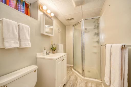 Lower-level 3/4 bathroom. Clean, bright, and steps from the lower-level bedroom.