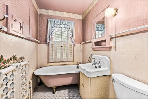 Bathroom with Clawfoot Soaking Tub and Ornate Radiator