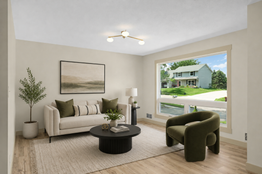 Main floor living room with large picture window. Some virtual staging
