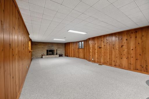 Lower level family room, with wood burning fireplace