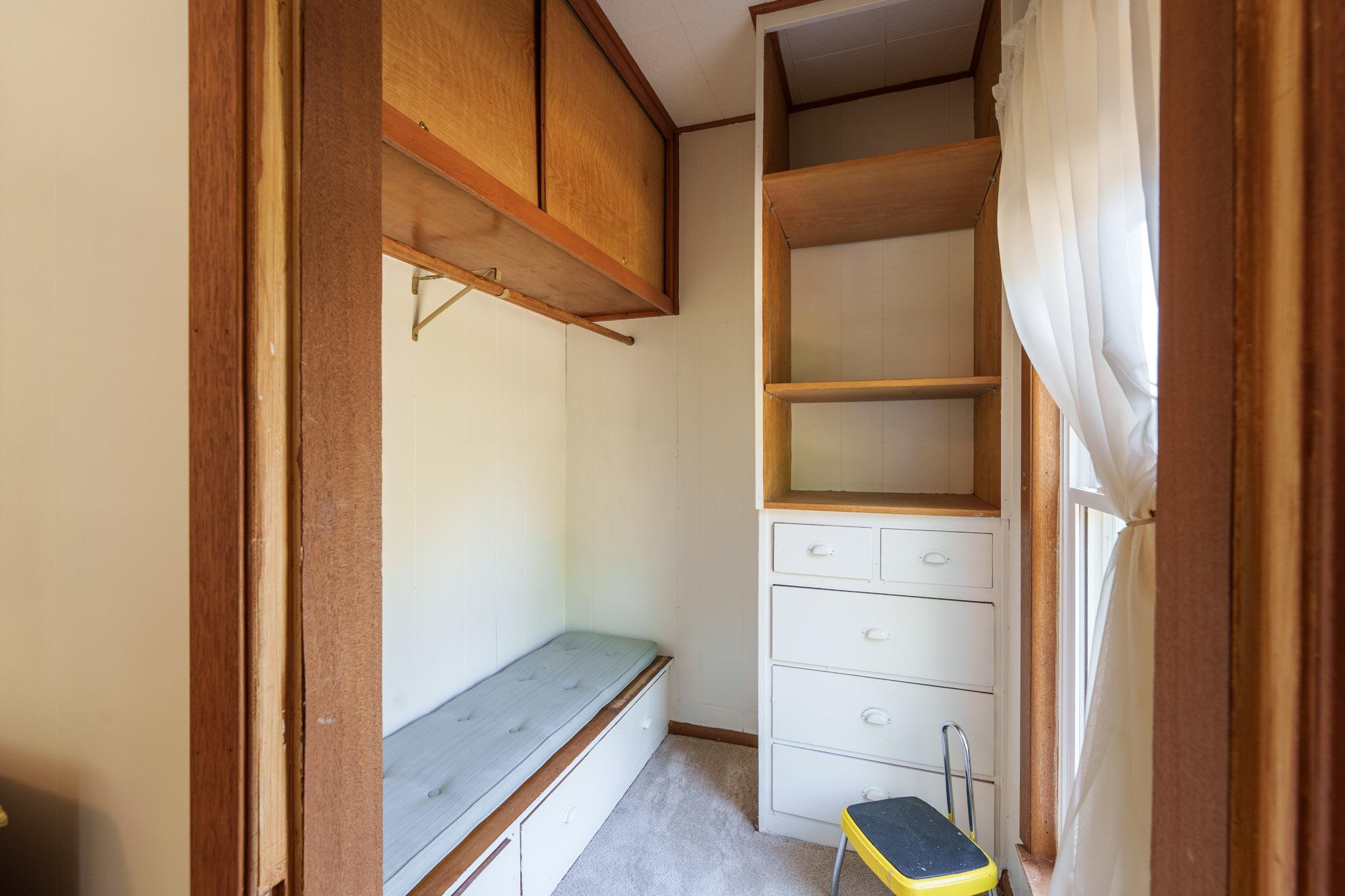 Bedroom two features a walk-in closet with bench and built-in drawers.