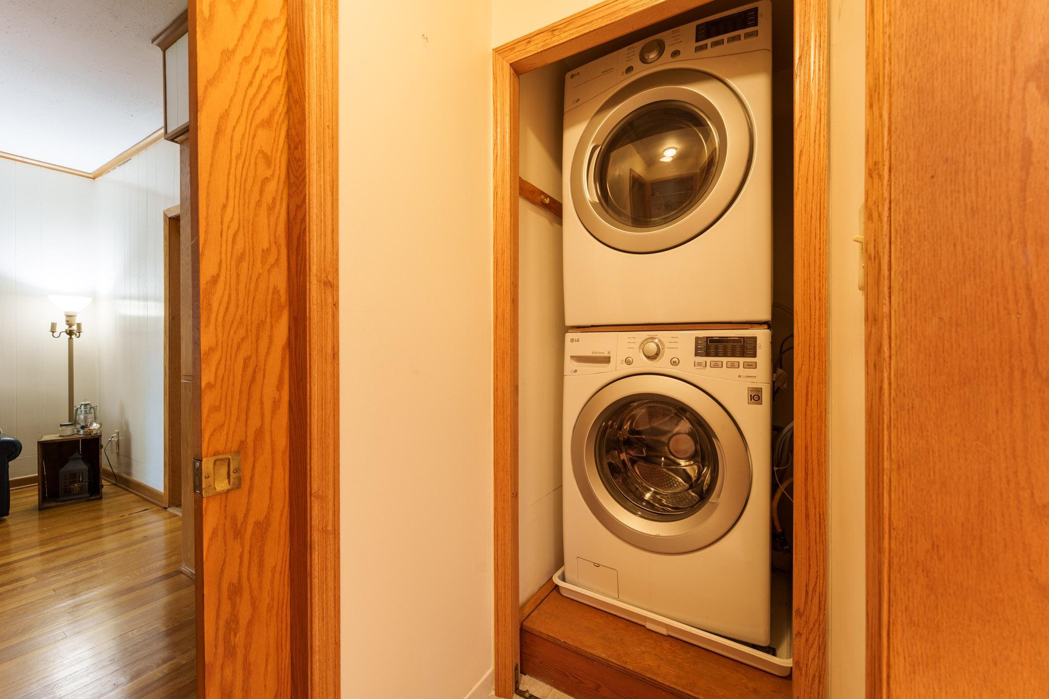 Main floor stacked laundry units located between the library and the main floor bath!