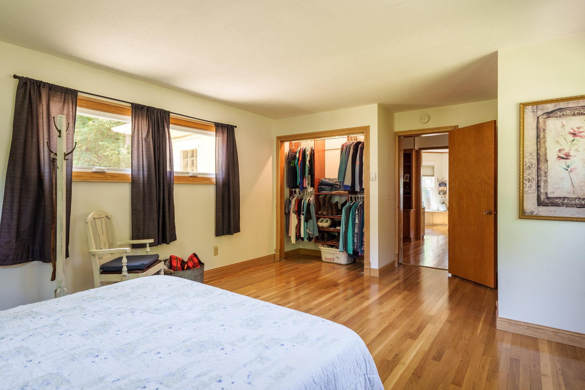 The primary bedroom offers an abundance of natural light from three walls of windows!