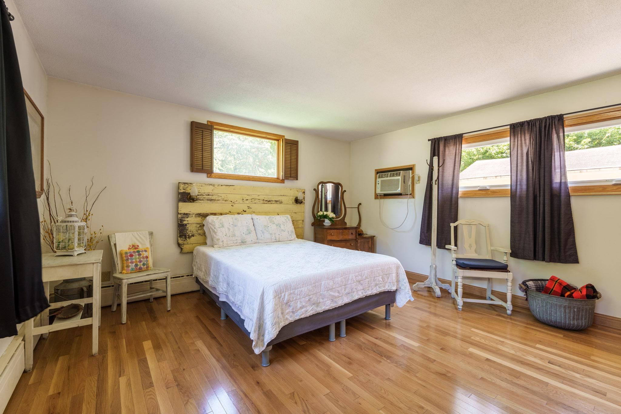 The main floor primary bedroom addition was done with care to make it feel like it has always been a part of this great home!