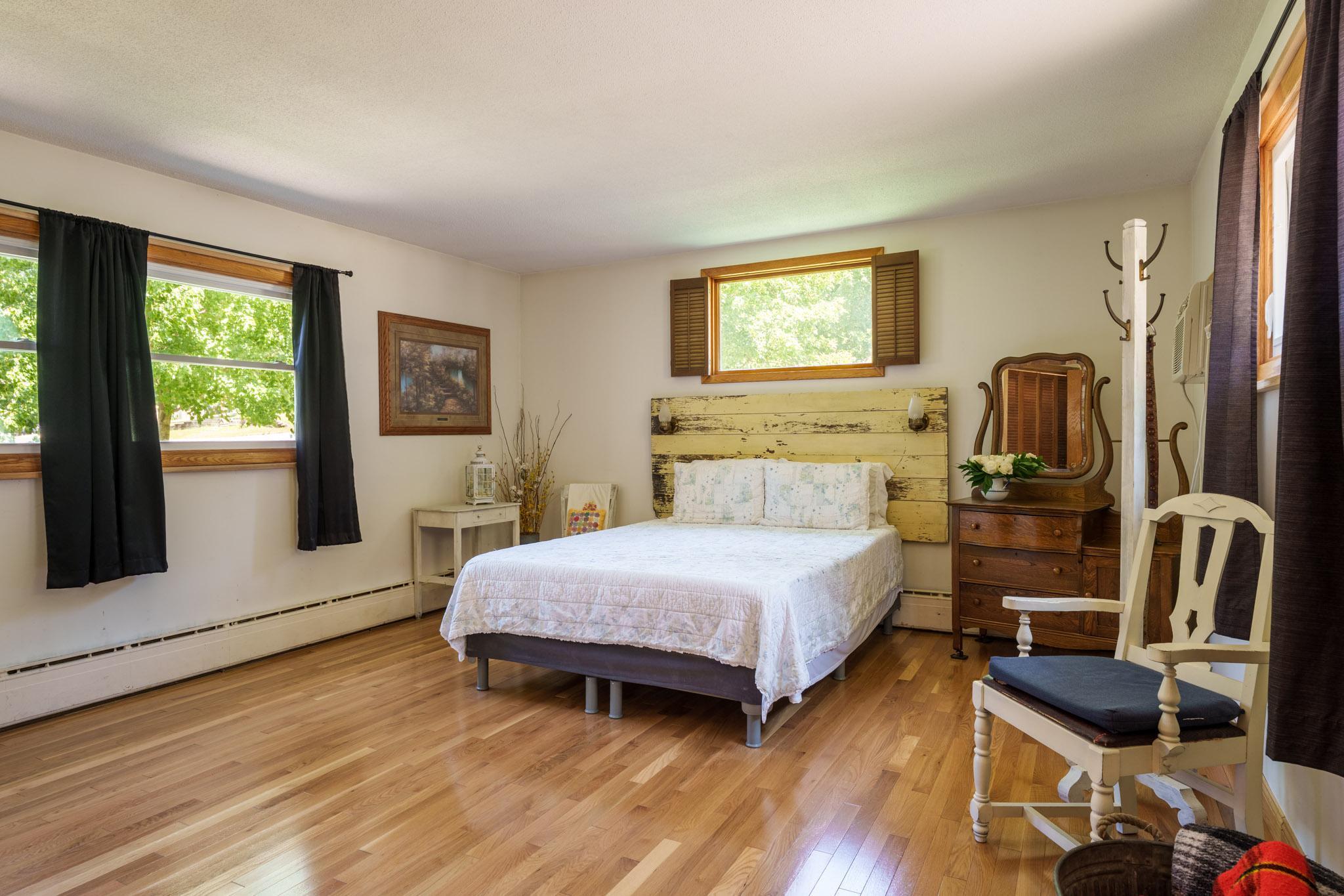 Another view of primary bedroom.