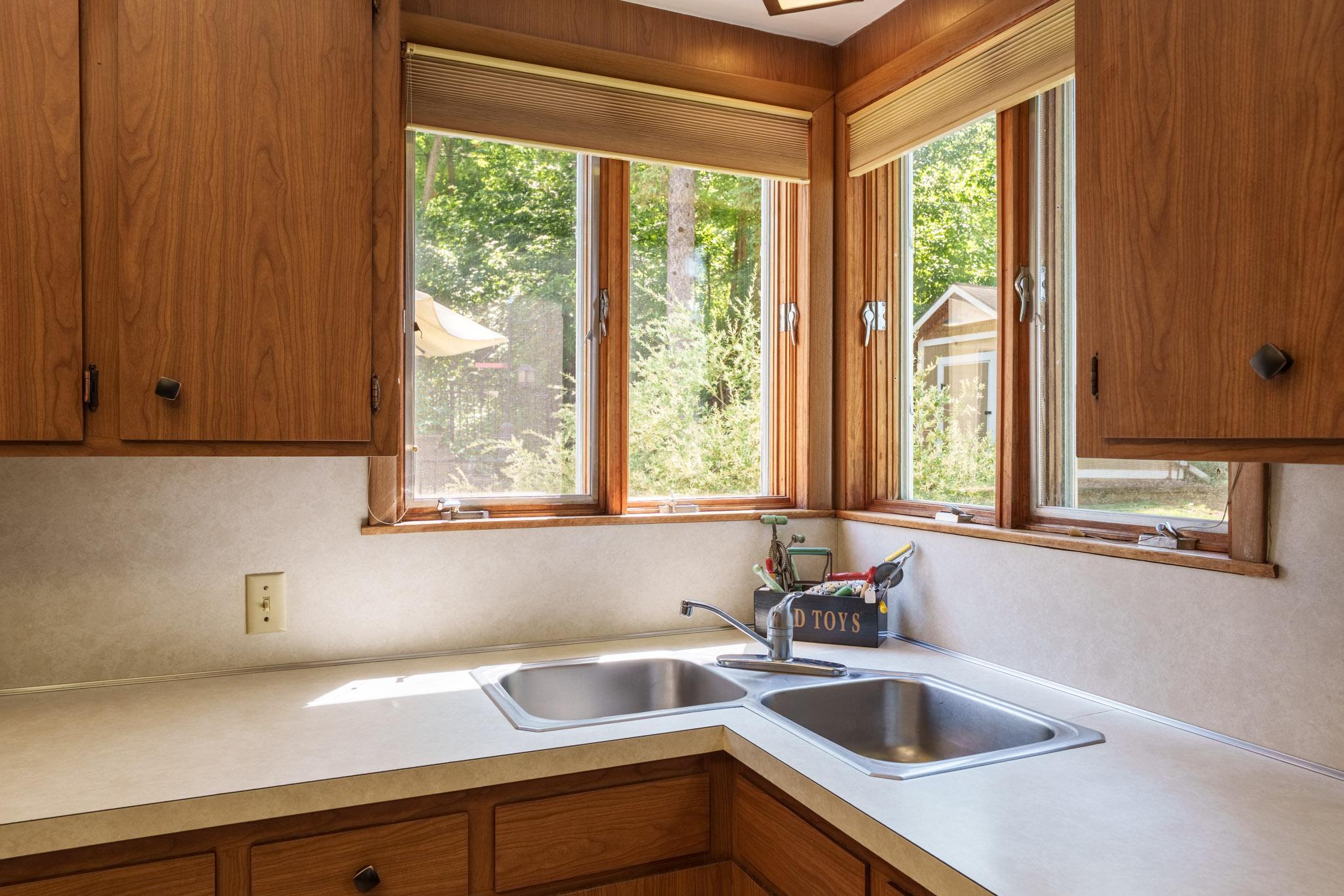 You'll love the corner sink and the windows overlooking the landscaped back yard!
