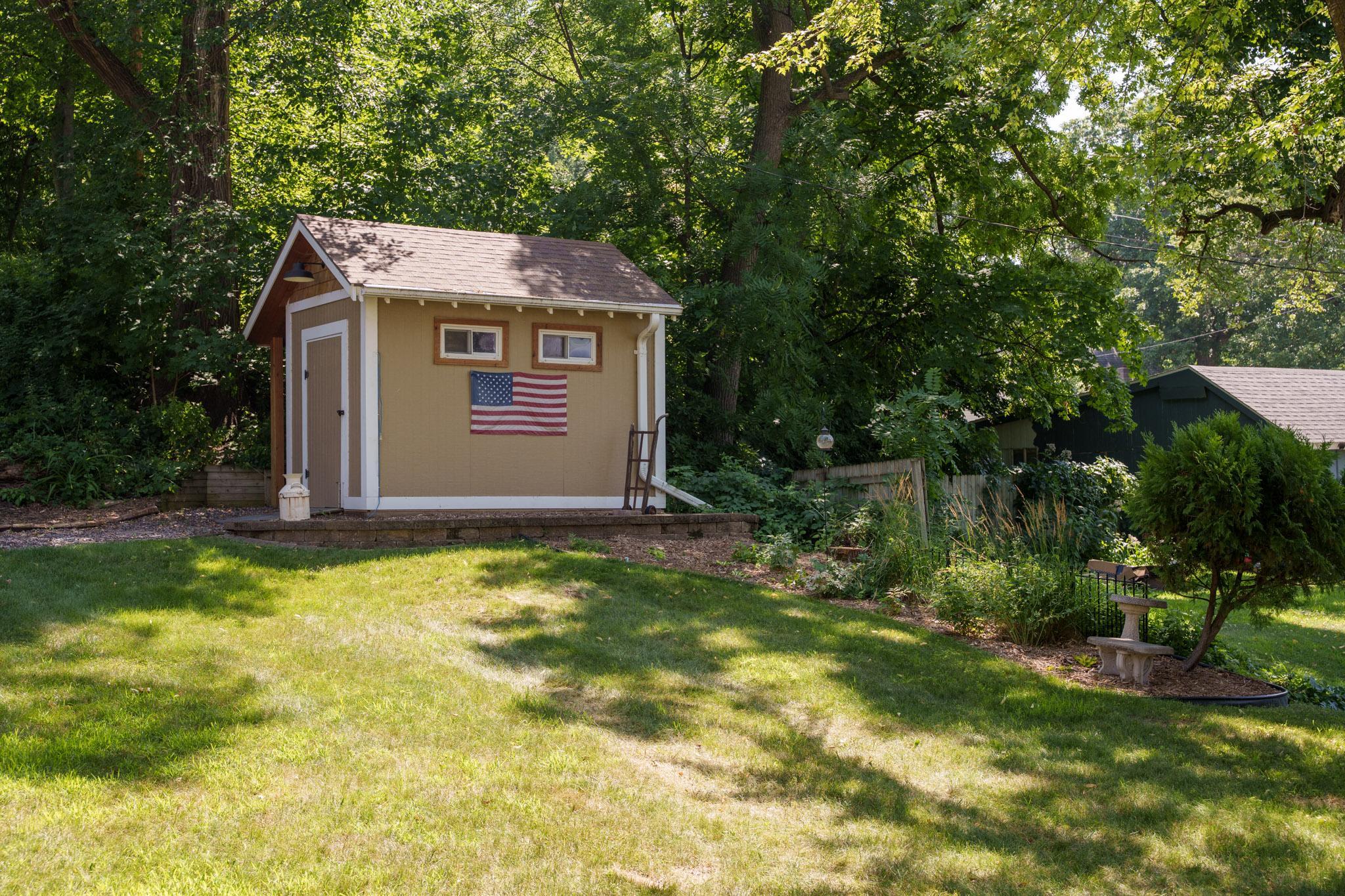 The seller added a large storage shed which is perfect for storing patio furniture, planters, and garden tools!