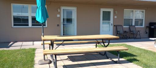 Front door, end unit, no interior stairs, includes picnic table with umbrella.