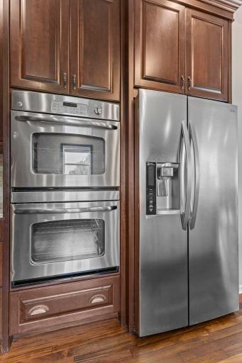 Hidden spice storage, pull-out drawers, soft-close cabinetry.