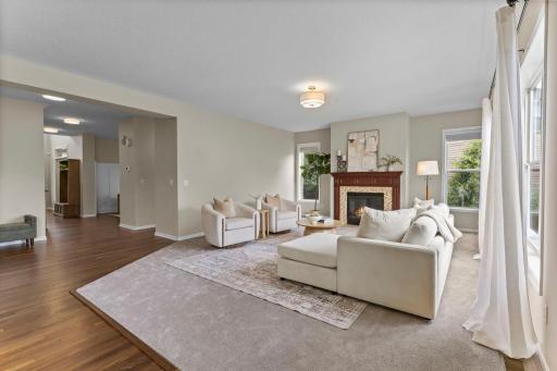 Spacious living room centered around a gas fireplace.