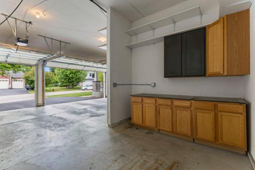 Oversized 3-car garage with a workshop bump-out adds utility and storage.