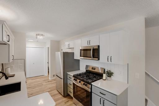 Updated kitchen with new SS appliances, cabinets, countertops and backsplash!
