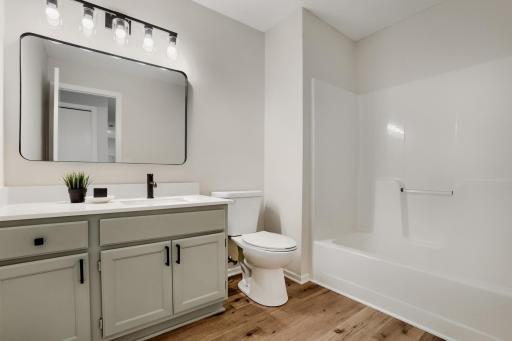 Updated full bathroom on upper level with counter space!