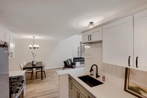 Open-concept layout from kitchen to dining area and living room.