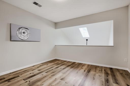 Versatile loft space - perfect for home office or family room.