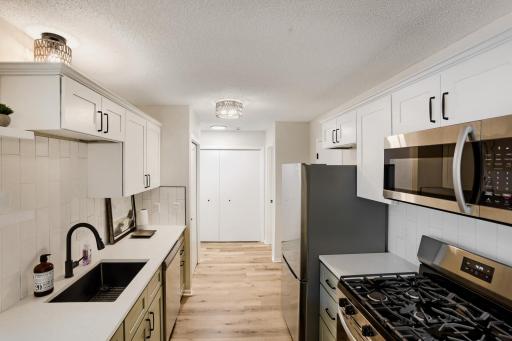 Gas range and under-mount sink for easy clean-up!