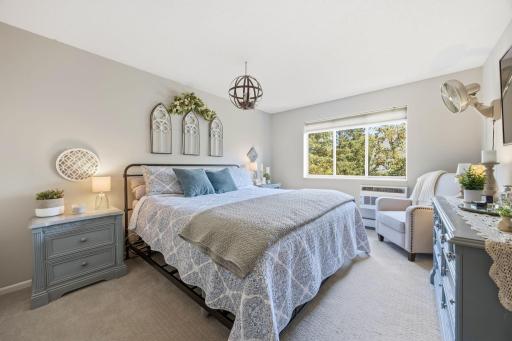 Large Primary Bedroom that feels so private with the trees outside.