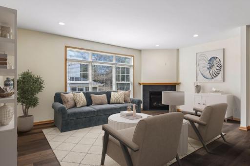 Bright, open-concept living with soaring ceilings and natural light. (Virtually Staged)
