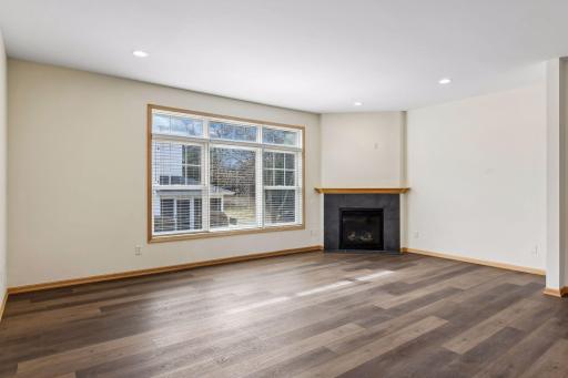 Inviting living room anchored by a cozy gas fireplace.