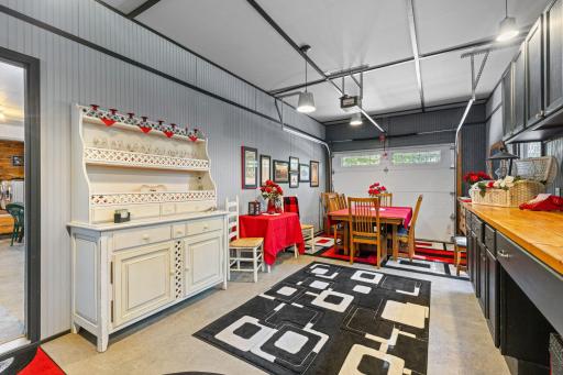 Third stall garage space is heated and insulated. Set up for a great hobby space with built-in cabinets.