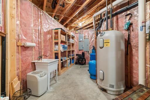 Utility room with air exchanger, owned water softener, radon mitigation system, electric meter is off peak
