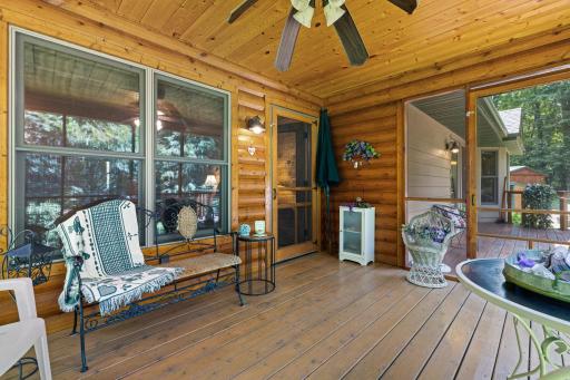 Screen porch is attached to the primary bedroom, with access also to the back deck