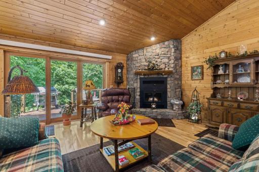 Vaulted living room with wood burning fireplace